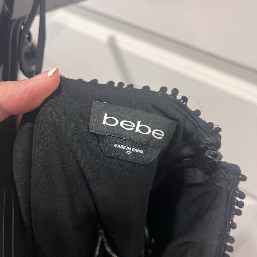 Bebe Black Dress ,blue & off white . Never worn . No tags